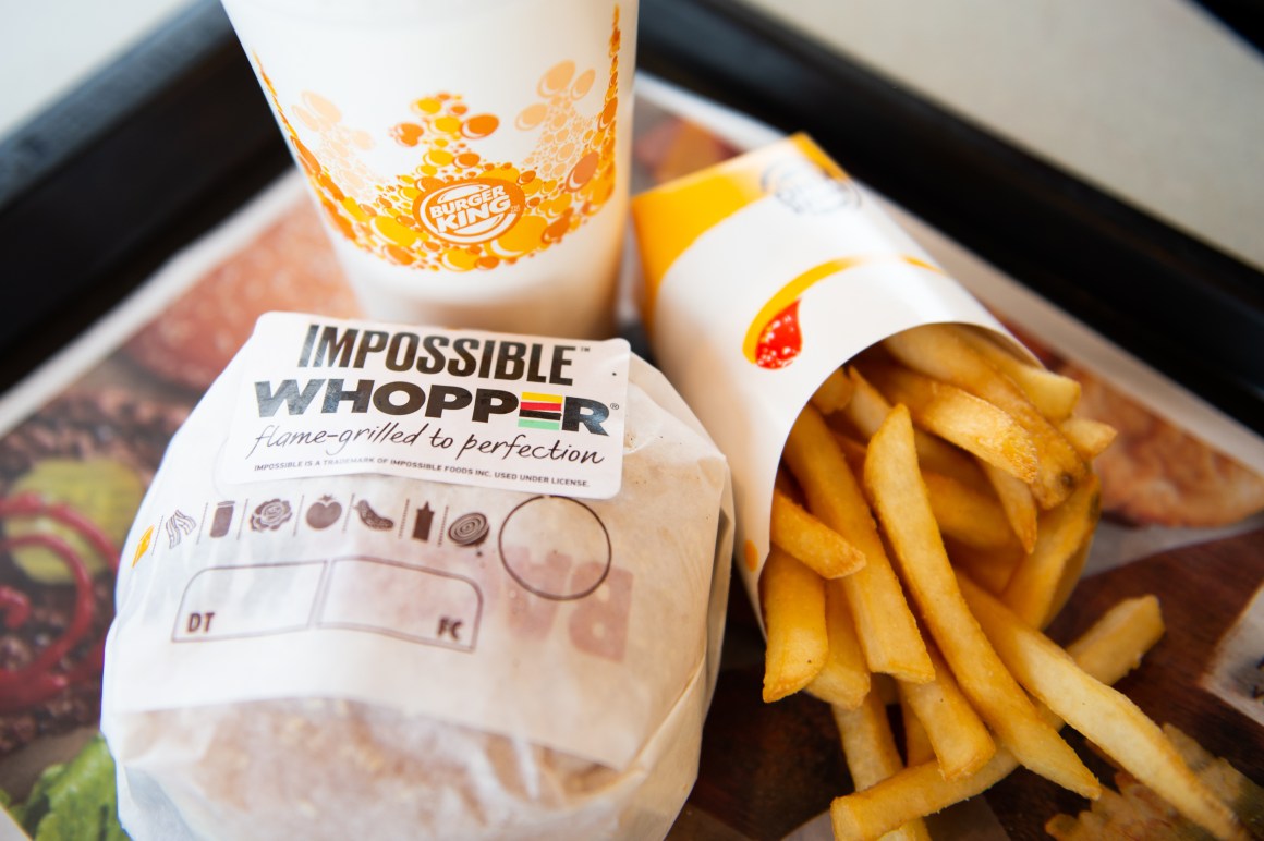 An 'Impossible Whopper' sits on a table at a Burger King restaurant on April 1st, 2019, in Richmond Heights, Missouri. Burger King announced on Monday that it is testing out Impossible Whoppers, made with plant-based patties from Impossible Foods, in 59 locations in and around the St. Louis area.