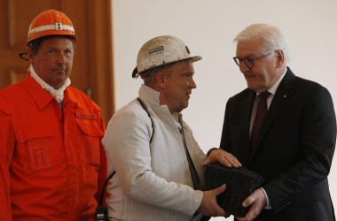 Coal miners give German President Frank-Walter Steinmeier a symbolic final chunk of coal in a ceremony at Schloss Bellevue presidential palace on April 3rd, 2019, in Berlin, Germany. Germany's last underground coal mine, located in the Ruhr region, closed in December. However, Germany still mines large amounts of lignite coal from open cast mines near Cologne and in eastern Germany.