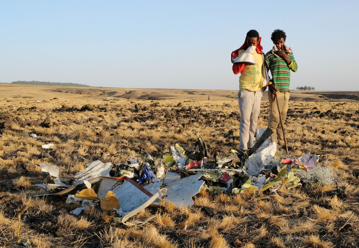 Two local boys examine a pile of twisted metal gathered by workers during the continuing recovery efforts at the crash site of Ethiopian Airlines Flight 302 on March 11th, 2019, in Bishoftu, Ethiopia. The plane was just six minutes into its flight to Nairobi, Kenya, when it crashed, killing all 157 passengers and crew on board on March 10th. As a result of the crash, Ethiopia joined China and other countries in grounding its fleet of Boeing 737 Max 8 jets.