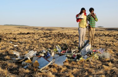 Two local boys examine a pile of twisted metal gathered by workers during the continuing recovery efforts at the crash site of Ethiopian Airlines Flight 302 on March 11th, 2019, in Bishoftu, Ethiopia. The plane was just six minutes into its flight to Nairobi, Kenya, when it crashed, killing all 157 passengers and crew on board on March 10th. As a result of the crash, Ethiopia joined China and other countries in grounding its fleet of Boeing 737 Max 8 jets.