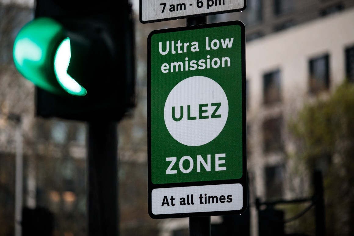 A green sign demarcates London's Ultra Low Emissions Zone as the charge comes into effect on April 8th, 2019, in London, England. In a bid by Transport for London to improve air quality, older and more polluting cars will be charged £12.50 to enter the ULEZ area and congestion zone.