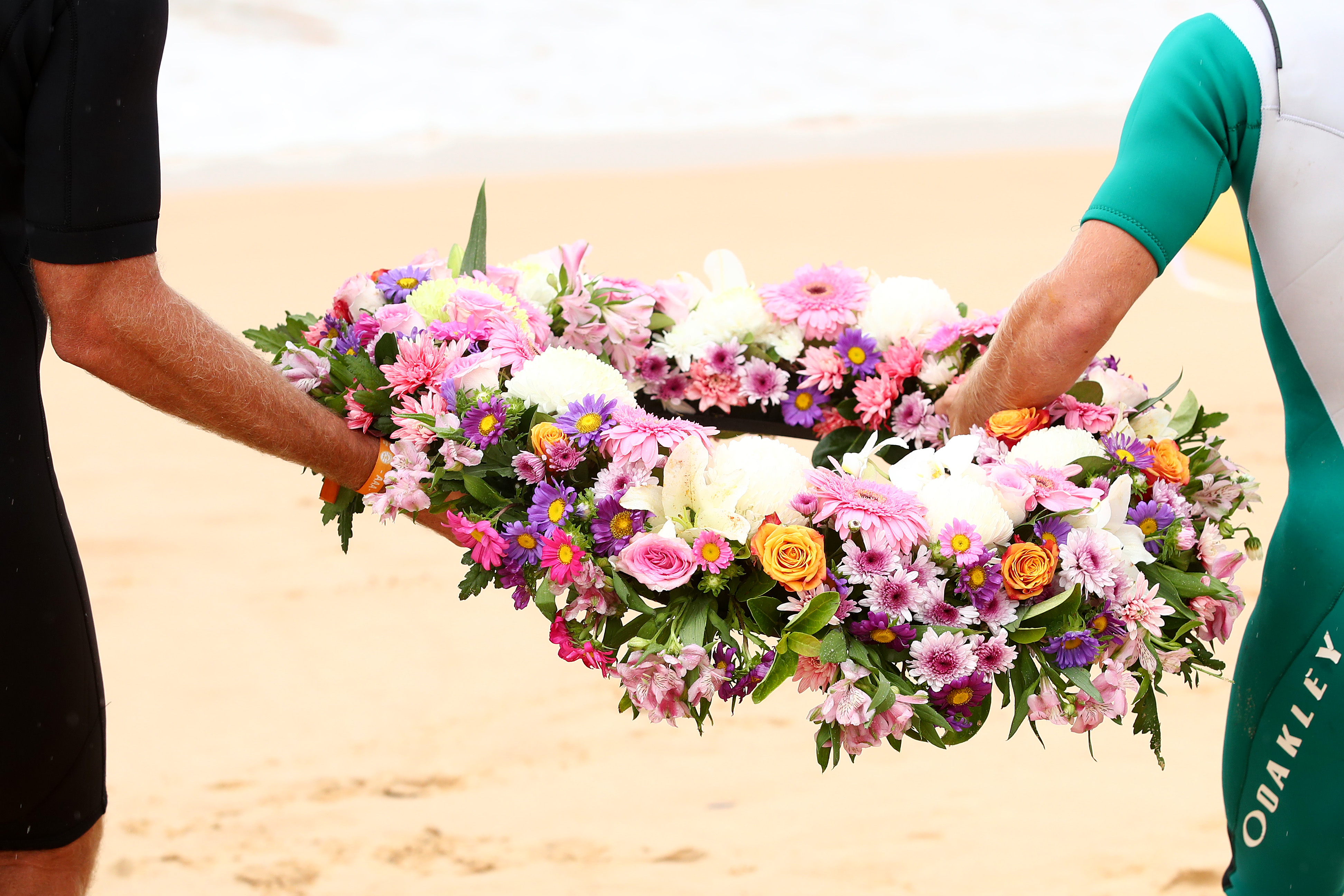 Locals and surfers competing in the Sydney Surf Pro participate in a paddle-out and wreath laying and observe a minute of silence to remember victims of the Christchurch mosque attacks at Manly Beach on March 17th, 2019, in Sydney, Australia.