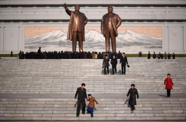 A man and child walk away after paying their respects before the statues of late North Korean leaders Kim Il-sung and Kim Jong-il, as part of celebrations marking the anniversary of the birth of Kim Il-sung, known as the Day of the Sun, on Mansu hill in Pyongyang on April 15th, 2019.