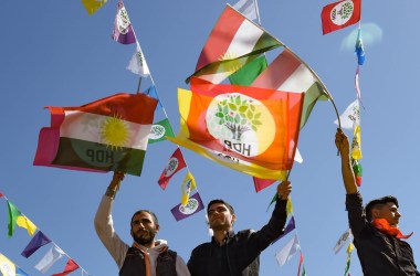 Men wave flags as they celebrate Nowruz festivities on March 21st, 2019, in Diyarbakir, Turkey. Nowruz, which starts on the vernal equinox and marks the Iranian New Year, is celebrated by more than 300 million people in diverse communities across the world.