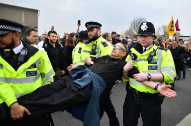 Police officers remove protesters from a blockade on Waterloo Bridge during the second day of a coordinated protest by the Extinction Rebellion group on April 16th, 2019, in London, England. More than 100 arrests have been made, with demonstrations blocking a number of locations across the capital.