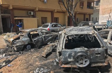 Two men stand at the scene of an overnight rocket attack, which no group has claimed responsibility for so far, in the Libyan capital of Tripoli on April 17th, 2019. A number of rockets struck parts of Tripoli late yesterday after strongman Khalifa Haftar launched an offensive earlier this month to take the Libyan capital, witnesses and journalists said. At least seven powerful explosions rocked the city center. Shortly afterwards, witnesses said, columns of smoke were seen above the district of Abu Salim in the south of the city, which was hit by a number of rockets.