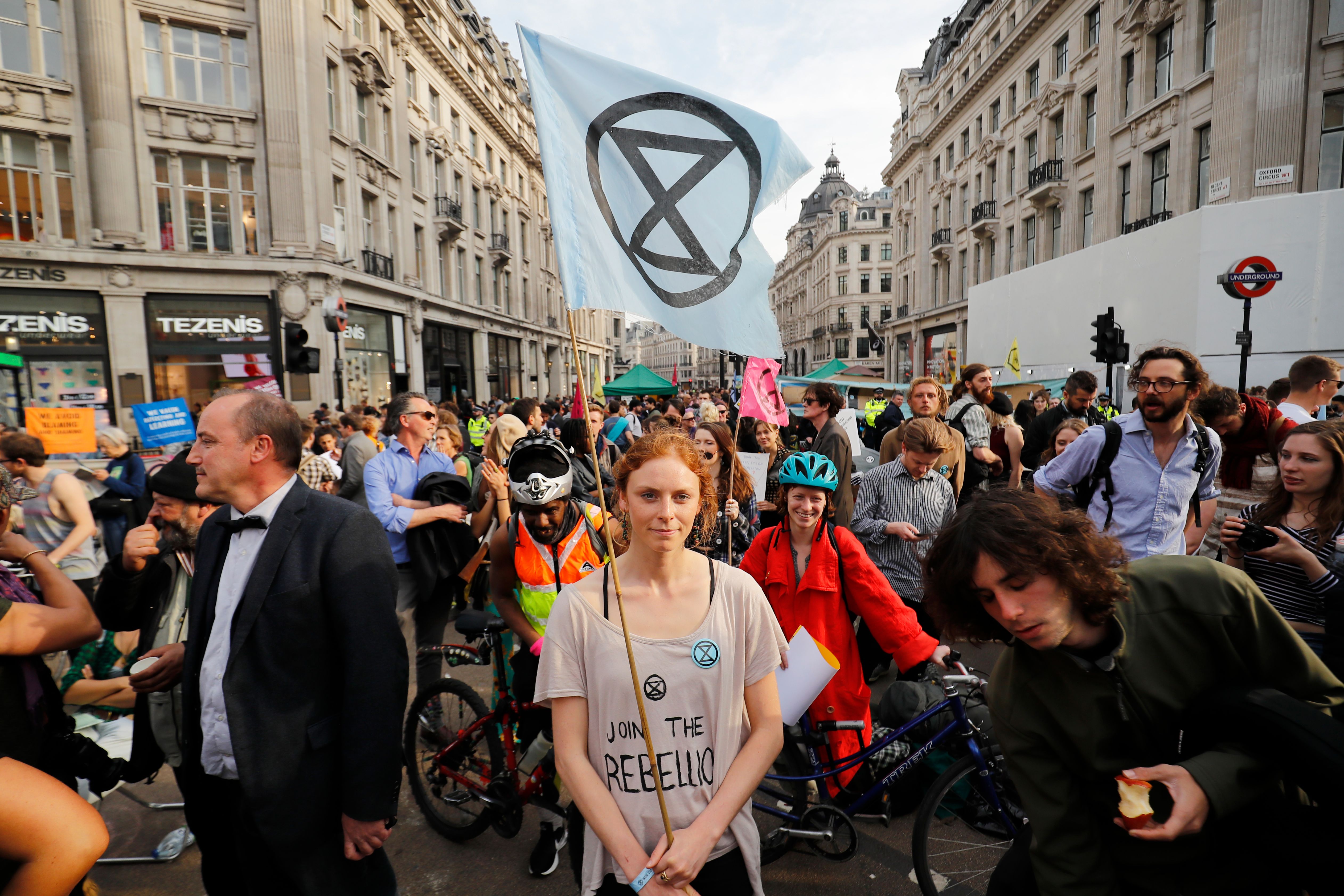 Climate change activists block the road junction at Oxford Circus in central London on April 18th, 2019, during an environmental protest by the Extinction Rebellion group. Climate change activists on Thursday brought parts of the British capital to a standstill on the fourth consecutive day of demonstrations.