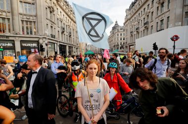 Climate change activists block the road junction at Oxford Circus in central London on April 18th, 2019, during an environmental protest by the Extinction Rebellion group. Climate change activists on Thursday brought parts of the British capital to a standstill on the fourth consecutive day of demonstrations.