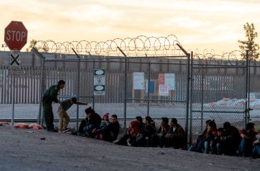 Border Patrol agents are pictured detaining and processing a group of migrants near the Paso Del Norte International Bridge connecting the U.S.–Mexico border cities of El Paso, Texas, and Ciudad Juárez, Chihuahua, on the evening of April 18th, 2019, in El Paso.