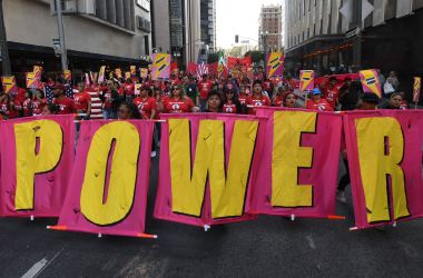 Union members, activists, and their supporters march through Los Angeles during their annual May Day procession in support of workers' rights and immigrant freedom on May 1st, 2019.