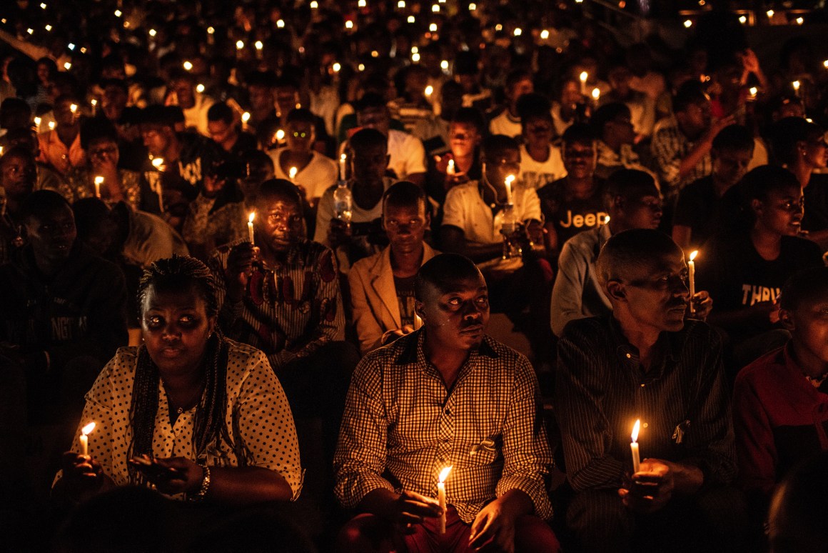 At a commemoration ceremony during the 25th anniversary of the Rwandan genocide, in which 800,000 Tutsis and moderate Hutus were killed over a 100-day period, people hold candles at Amahoro Stadium in Kigali, Rwanda, on April 7th, 2019.