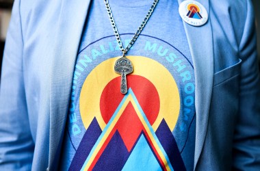 Campaign manager for the Denver Psilocybin Initiative Kevin Matthews wears a mushroom necklace at an election watch party for a bill to decriminalize psilocybin mushrooms.