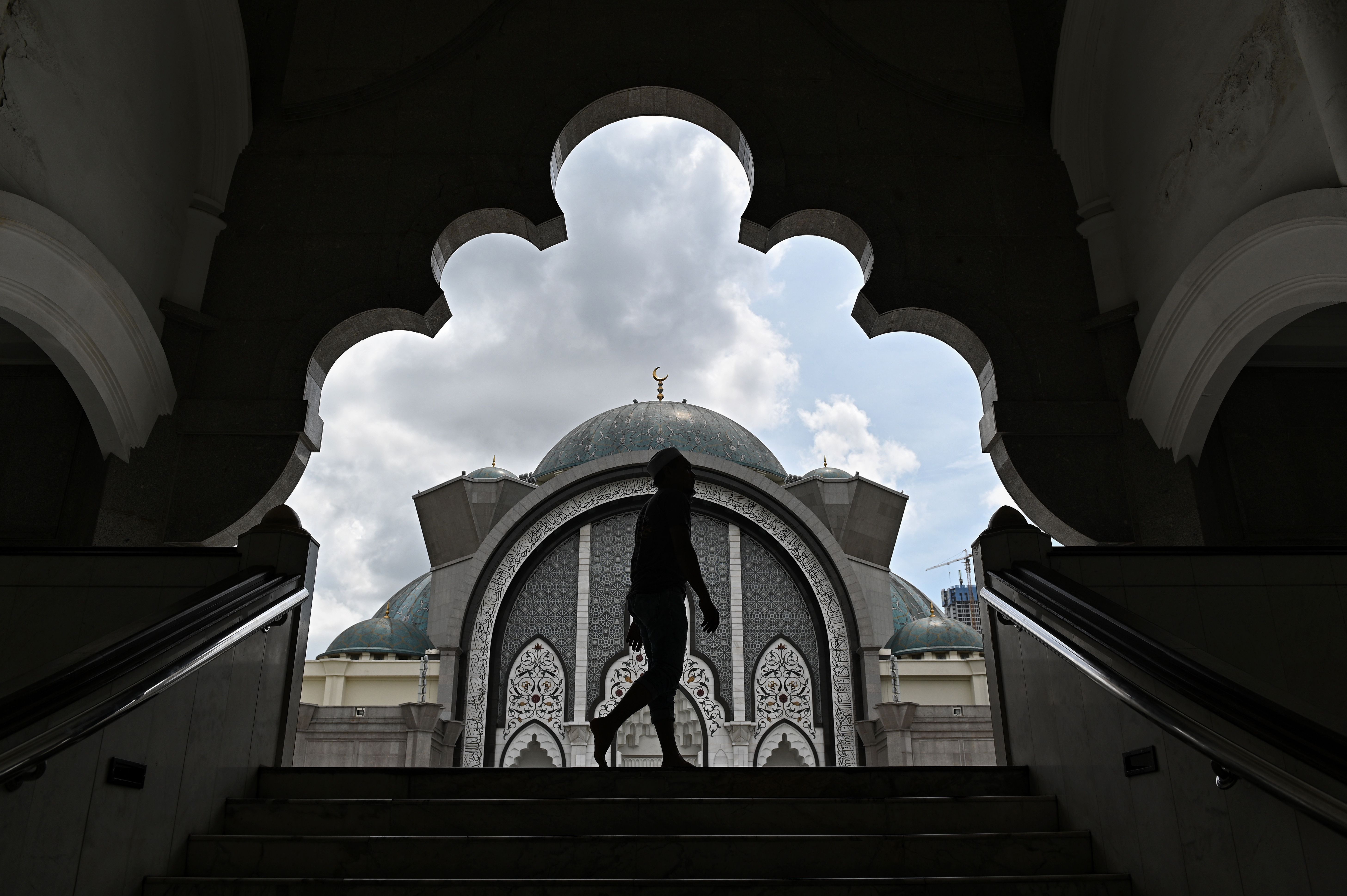 A worshipper arrives to offer a prayer at the Federal Territory Mosque during the holy Islamic month of Ramadan in Kuala Lumpur, Malaysia, on May 9th, 2019.