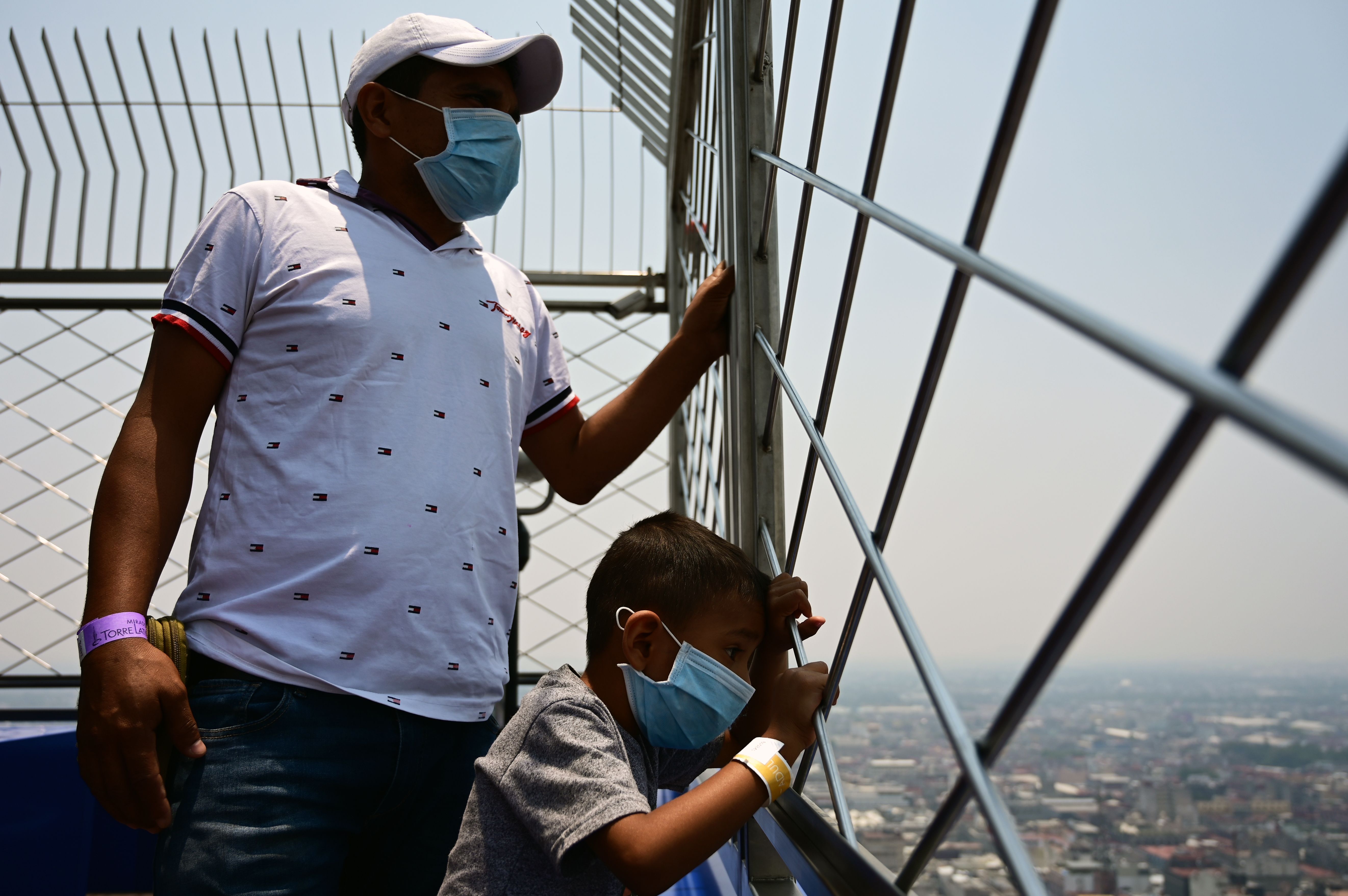 Visitors enjoy the view, despite high levels of air pollution, from the Latin American tower viewpoint in Mexico City, on May 14th, 2019.