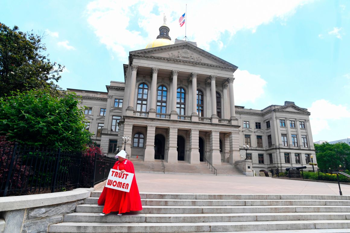 Activist Tamara Stevens with the Handmaids Coalition of Georgia leaves the Georgia Capitol after Democratic presidential candidate Senator Kirsten Gillibrand addressed an event to speak out against the recently passed "heartbeat" bill on May 16th, 2019, in Atlanta, Georgia.