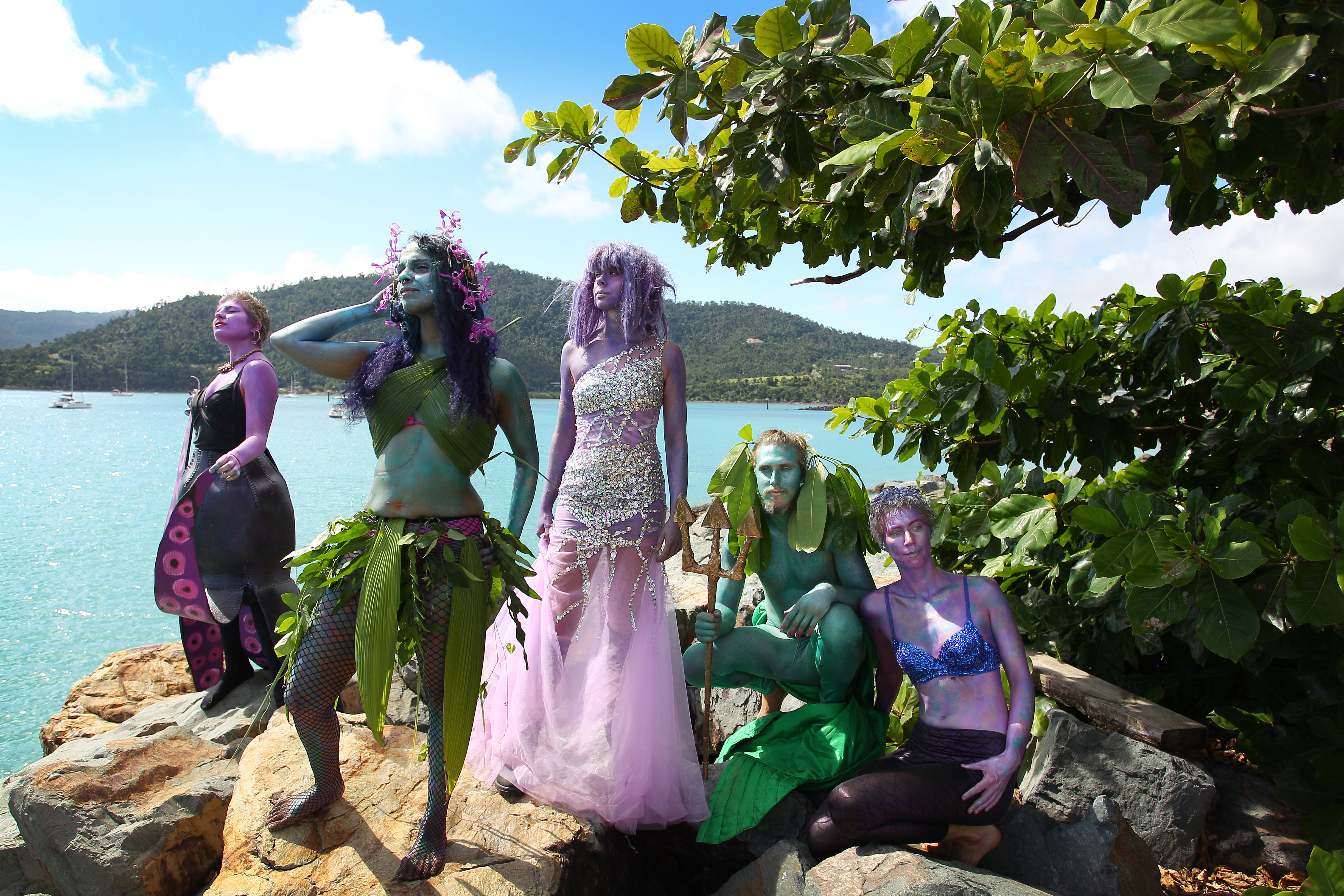 Environment activists dress in costumes and stand at the edge of Airlie Bay during an anti-Adani Carmichael coal mine rally on April 26th, 2019, in Airlie Beach, Australia.