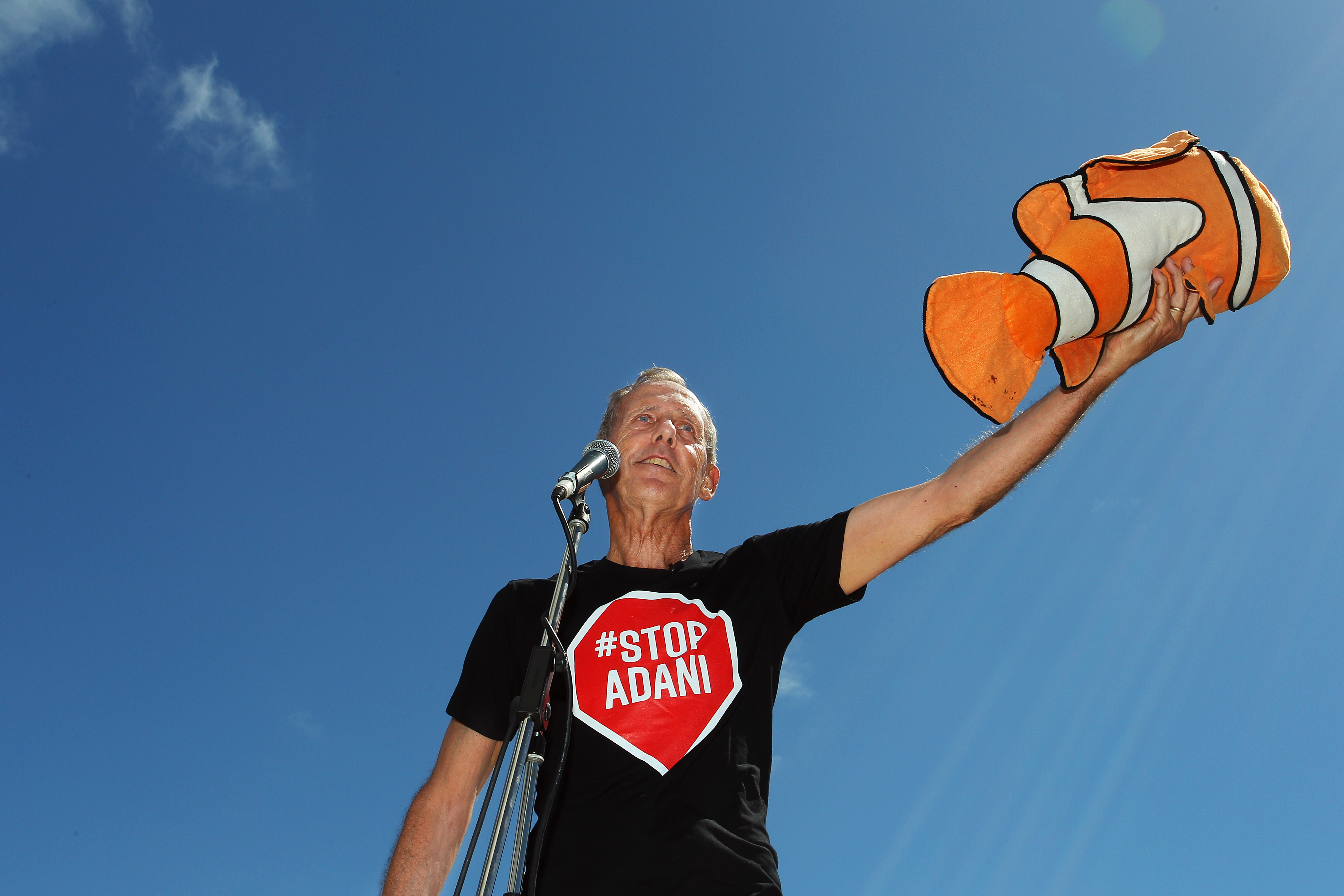 Bob Brown (former Greens leader and conservationist) holds a toy Nemo doll given to him by an audience member as he speaks during an anti-Adani Carmichael coal mine rally on April 26th, 2019, in Airlie Beach, Australia. Bob Brown has been leading a convoy of environmental activists through Australia's southern states toward Central Queensland as part of the #StopAdani movement.