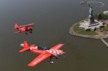 Aerobatic pilots Sean D. Tucker and Jessy Panzer (foreground) of Team Oracle fly down the Hudson River past the Statue of Liberty on May 22nd, 2019, during a media day in advance of the Bethpage Air Show at Jones Beach over Memorial Day weekend.