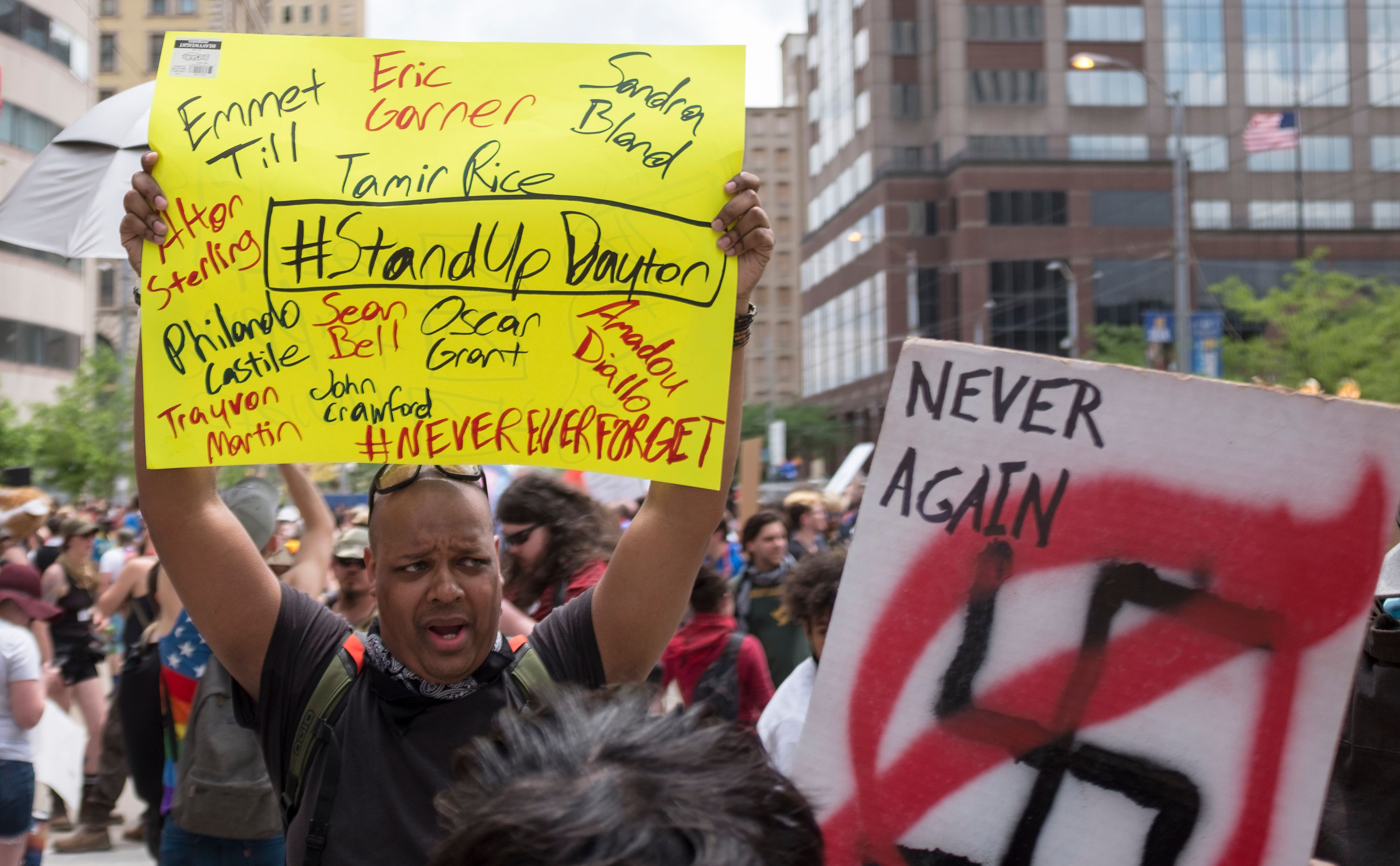 Counter-demonstrators hold signs in protest of a KKK-affiliated Honorable Sacred Knights rally in Dayton, Ohio, on May 25th, 2019.