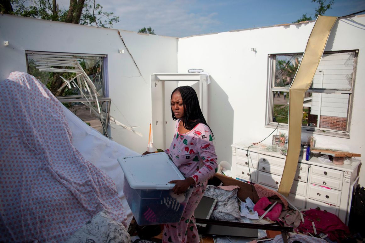 Sierra Waver gathers her belongings in Trotwood, Ohio, near Dayton, on May 28th, 2019, after powerful tornadoes ripped through the state overnight, causing at least one fatality, widespread damage, and power outages.