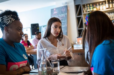 U.S. Representative Alexandria Ocasio-Cortez (D-New York) waits on a table at the Queensboro Restaurant, on May 31st, 2019, in the Queens borough of New York City. Ocasio-Cortez participated in an event to raise awareness for the One Fair Wage campaign, which calls to raise the minimum wage for tipped workers to a full minimum wage at the federal level.