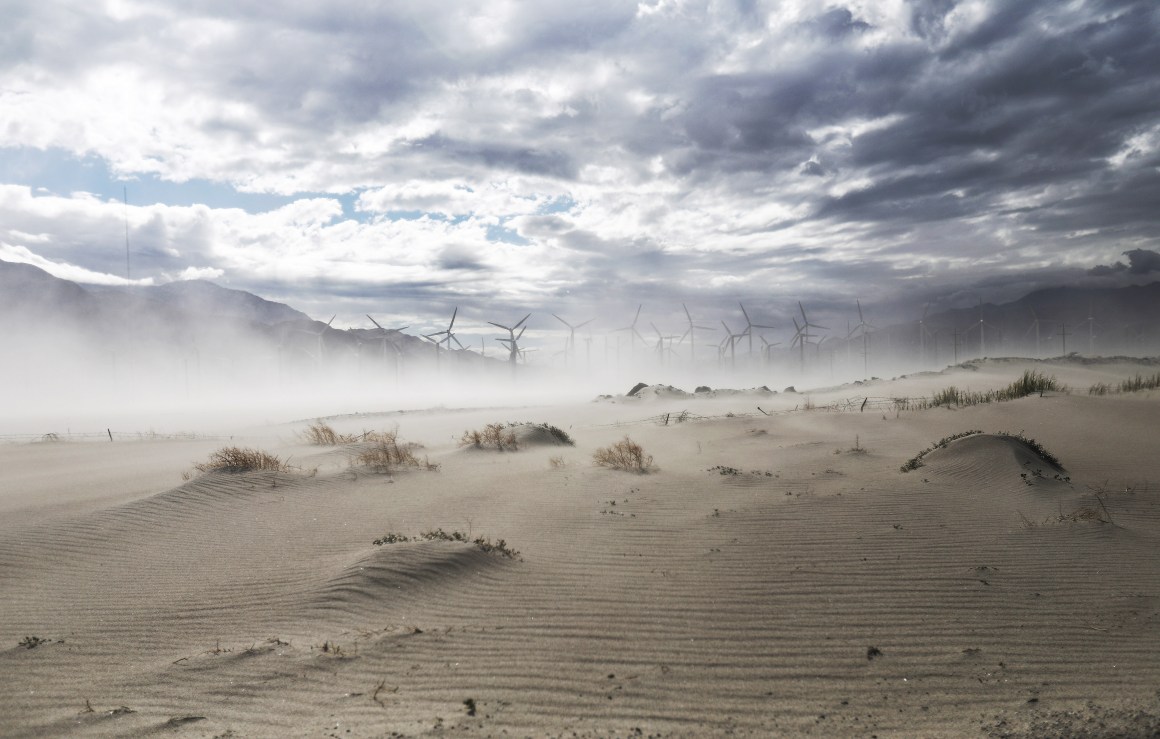 Strong winds blow sand at a wind farm in the Coachella Valley on May 6th, 2019, in Palm Springs, California. California's Fourth Climate Change Assessment found that temperatures of the inland deserts of Southern California, including the Coachella Valley, are expected to continue climbing. According to the report, average daily highs could increase as much as 14 degrees this century if greenhouse gas emissions keep rising.