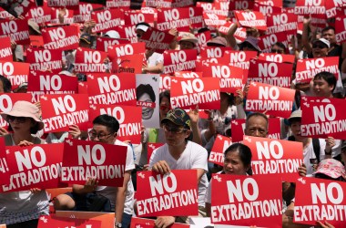 Protesters hold placards and shout slogans during a rally against the extradition law proposal on June 9, 2019, in Hong Kong.