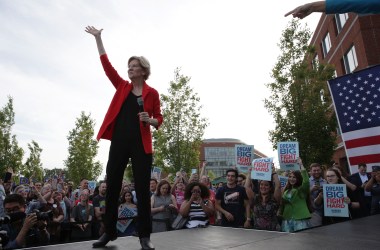 Democratic presidential hopeful Senator Elizabeth Warren waves during a campaign town hall at George Mason University on May 16th, 2019, in Fairfax, Virginia.