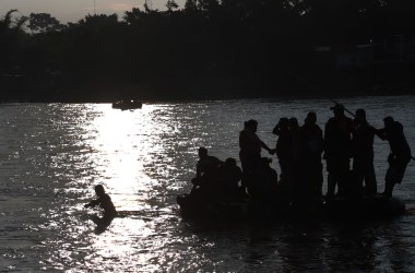 Migrants and residents use a makeshift raft to illegally cross the Suchiate river, from Tecun Uman, in Guatemala, to Ciudad Hidalgo, Mexico, on June 14th, 2019.