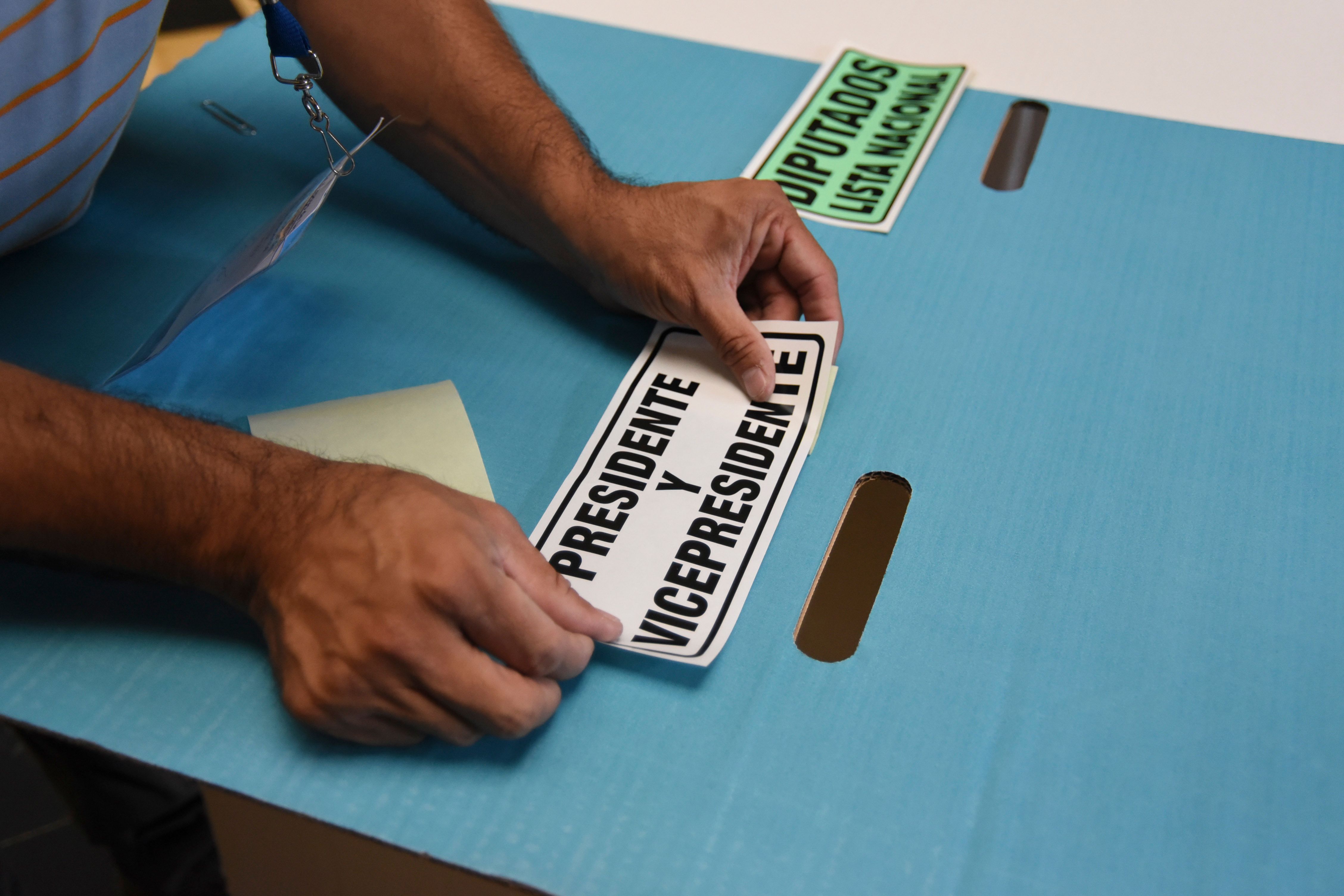 Guatemala's Supreme Electoral Tribunal workers set up a polling station in Guatemala City on June 15th, on the eve of the presidential elections.