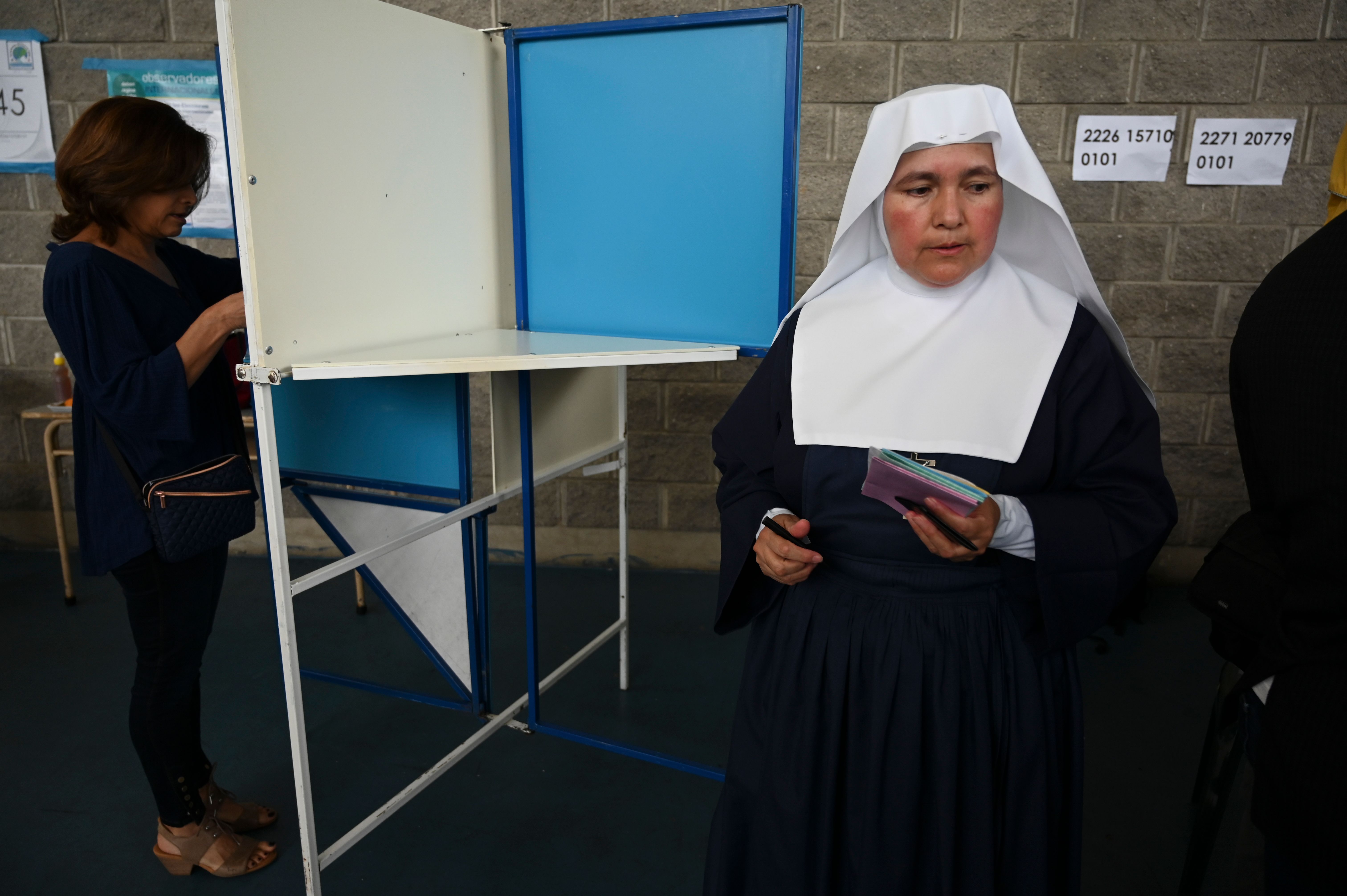 A nun votes at a polling station in Guatemala City on June 16th, during general elections.