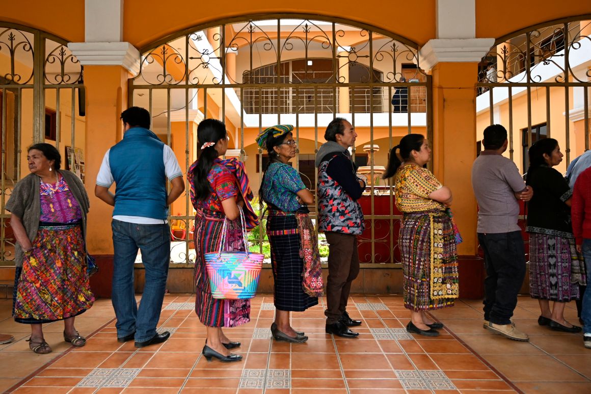 Locals line up to vote at a polling station in San Pedro Sacatepuez, Guatemala, on June 16th, during general elections. Corruption-weary Guatemalans were set to elect a new president Sunday after a tumultuous campaign that saw two leading candidates barred from taking part and the top electoral crimes prosecutor forced to flee the country, fearing for his life.