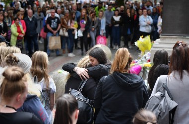 Two women hug while a two-minute silence is observed in memory of the victims of the Manchester Arena Bombing in Saint Anne's Square on May 22nd, 2019, in Manchester, England. The suicide bomb attack took place following a concert at Manchester Arena by singer Ariana Grande and claimed the lives of 22 people.