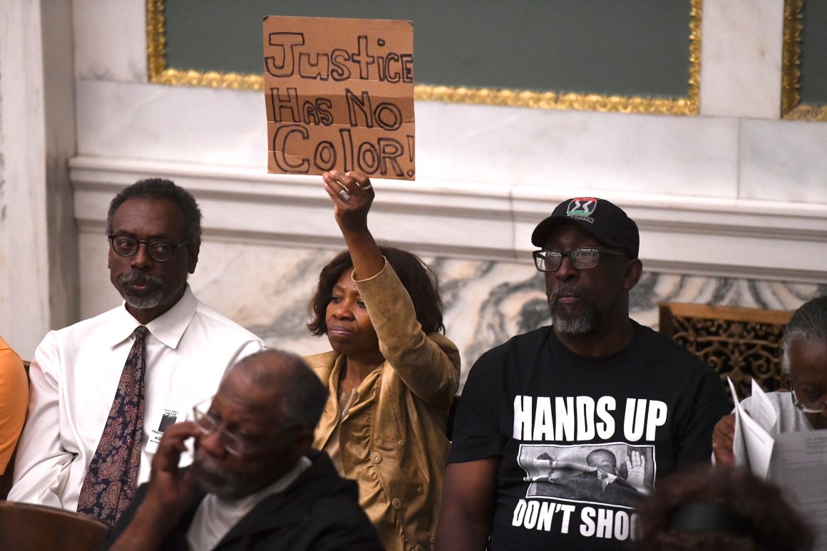 Demonstrators gather in the council chamber to protest in front of councilmen and councilwomen at Philadelphia City Hall on June 20th, 2019, in Philadelphia, Pennsylvania. Philadelphia police have confirmed that more than 70 officers have been placed on desk duty while authorities investigate alleged racist and violent social media posts that were unearthed by the Plain View Project.