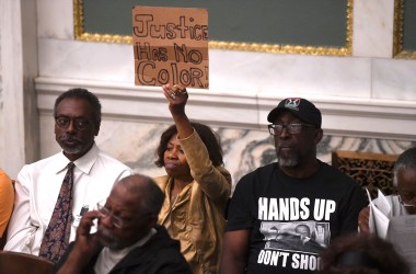 Demonstrators gather in the council chamber to protest in front of councilmen and councilwomen at Philadelphia City Hall on June 20th, 2019, in Philadelphia, Pennsylvania. Philadelphia police have confirmed that more than 70 officers have been placed on desk duty while authorities investigate alleged racist and violent social media posts that were unearthed by the Plain View Project.