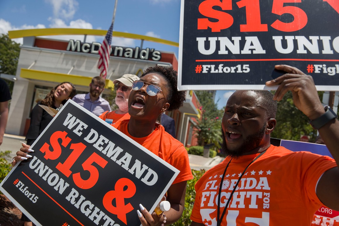 People gather to ask the McDonald’s corporation to raise workers' wages to a $15 minimum wage as well as demand the right to a union on May 23rd, 2019, in Fort Lauderdale, Florida. The nationwide protest was held on the day of the company’s shareholder meeting.