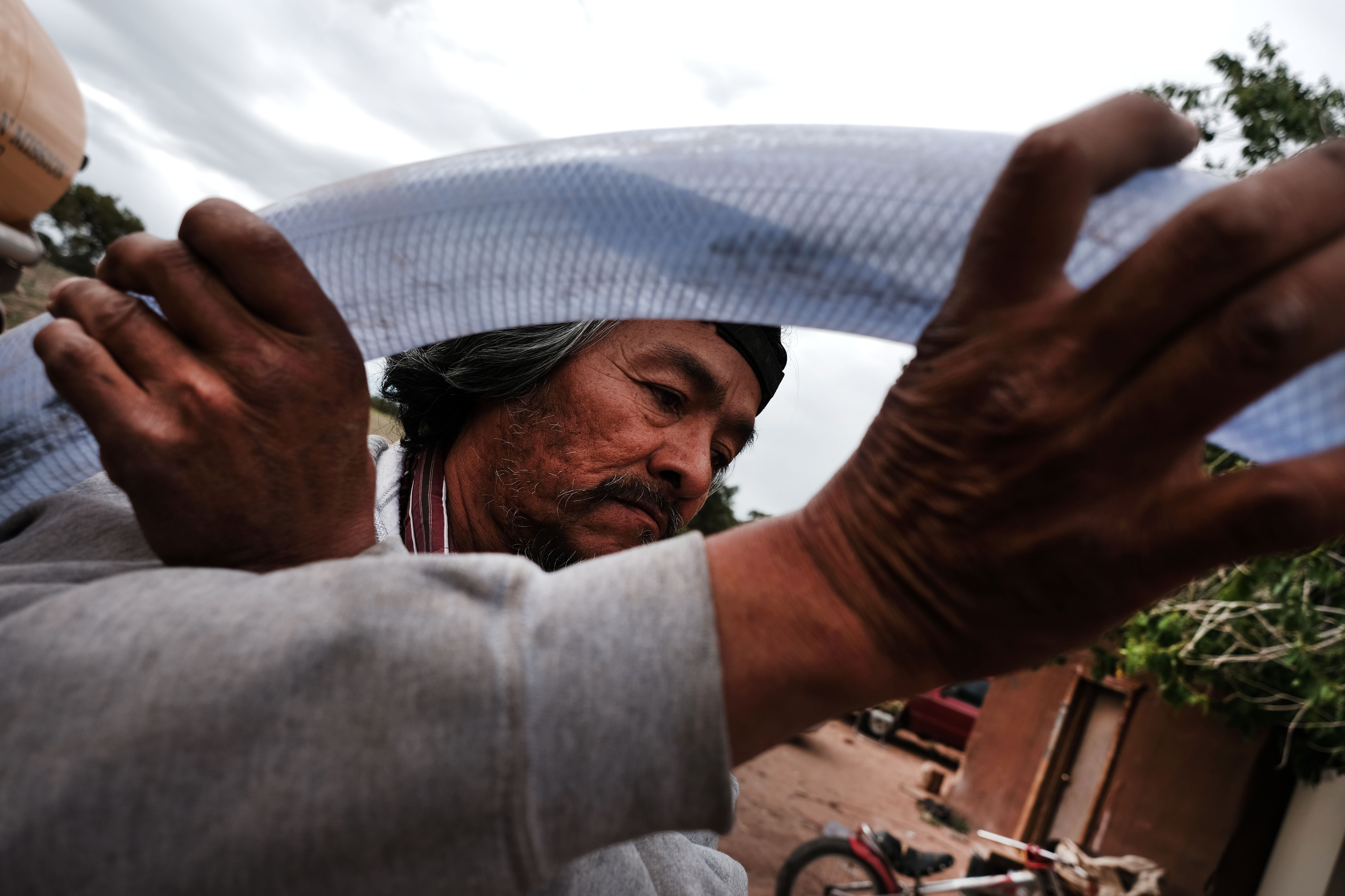 Cecil Joe fills another water tank on June 5th, 2019, in Thoreau, New Mexico. The Navajo Water Project has been supplying water on Navajo lands in New Mexico since 2013.