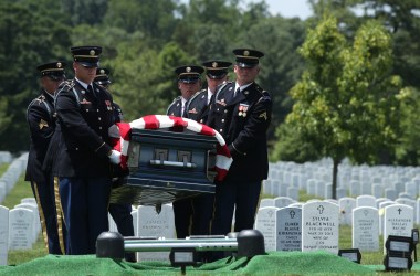 Members of the United States Army's 3rd Infantry Regiment, "The Old Guard," carry the flag-draped casket of World War II Army veteran Carl Mann to his final resting place during his funeral on the 75th anniversary of the D-Day invasion on June 6th, 2019, at Arlington National Cemetery in Arlington, Virginia. Mann, a native of Indiana, was among the troops who stormed Omaha Beach on D-Day during the amphibious landings at Normandy, France. He was awarded with seven Bronze Stars and three Purple Hearts throughout his years of military service.