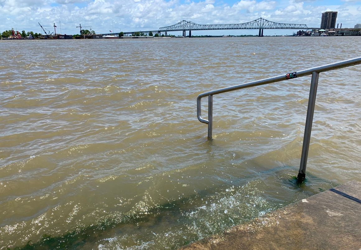 The Mississippi River laps at the stairs on a protective levee in New Orleans as Tropical Storm Barry approaches on July 11th, 2019.