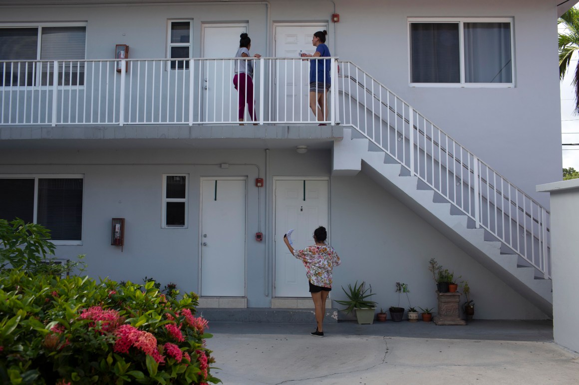 Immigration advocates with the Florida Immigrant Coalition go house to house handing out fliers on July 13th, 2019, in Little Havana in Miami, Florida, in advance of the Trump administration's nationwide immigration enforcement operation targeting migrant families.