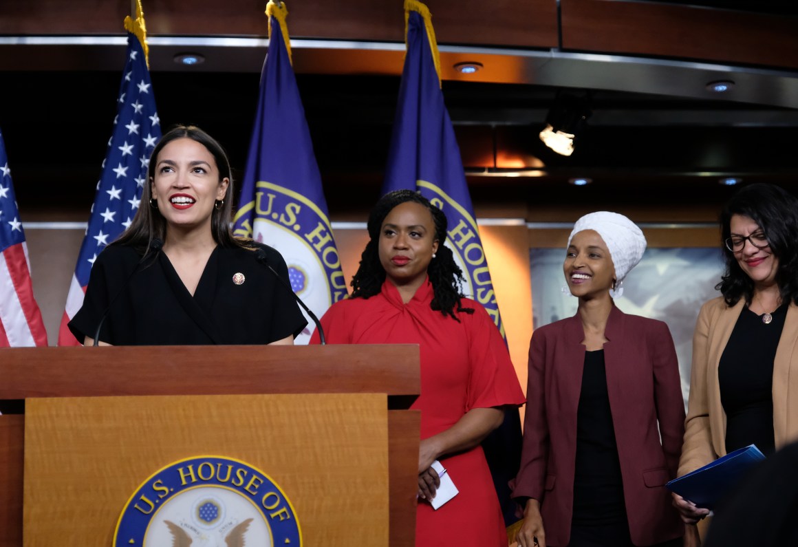 Representative Alexandria Ocasio-Cortez (D-New York) speaks as Representatives Ayanna Pressley (D-Massachusetts), Ilhan Omar (D-Minnesota), and Rashida Tlaib (D-Michigan) listen during a press conference at the U.S. Capitol on July 15th, 2019, held in response to Donald Trump's tweets.