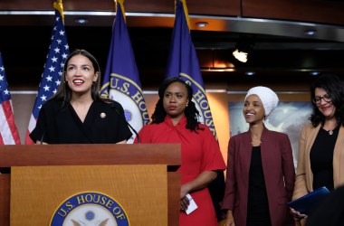 Representative Alexandria Ocasio-Cortez (D-New York) speaks as Representatives Ayanna Pressley (D-Massachusetts), Ilhan Omar (D-Minnesota), and Rashida Tlaib (D-Michigan) listen during a press conference at the U.S. Capitol on July 15th, 2019, held in response to Donald Trump's tweets.