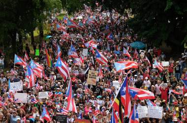 People march in San Juan on July 25th, 2019, one day after the Puerto Rico Governor Ricardo Rossello announced his resignation.