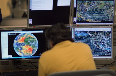 Senior hurricane forecaster Jack Beven studies computer models as he tracks Tropical Storm Arlene at the National Hurricane Center.