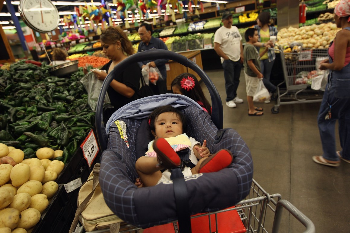 Zury Vizguerra, at age five months, waits while her mother, an undocumented immigrant from Mexico, shops for groceries on July 11th, 2011, in Aurora, Colorado.