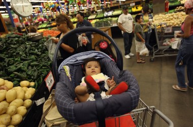 Zury Vizguerra, at age five months, waits while her mother, an undocumented immigrant from Mexico, shops for groceries on July 11th, 2011, in Aurora, Colorado.