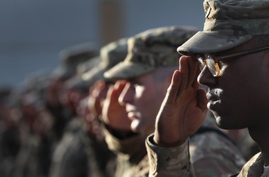 U.S. Army soldiers salute during the national anthem during the an anniversary ceremony of the terrorist attacks on September 11, 2001 on September 11, 2011 at Bagram Air Field, Afghanistan. Ten years after the 9/11 attacks in the United States and after almost a decade war in Afghanistan, American soldiers paid their respects in a solemn observence of the tragic day.