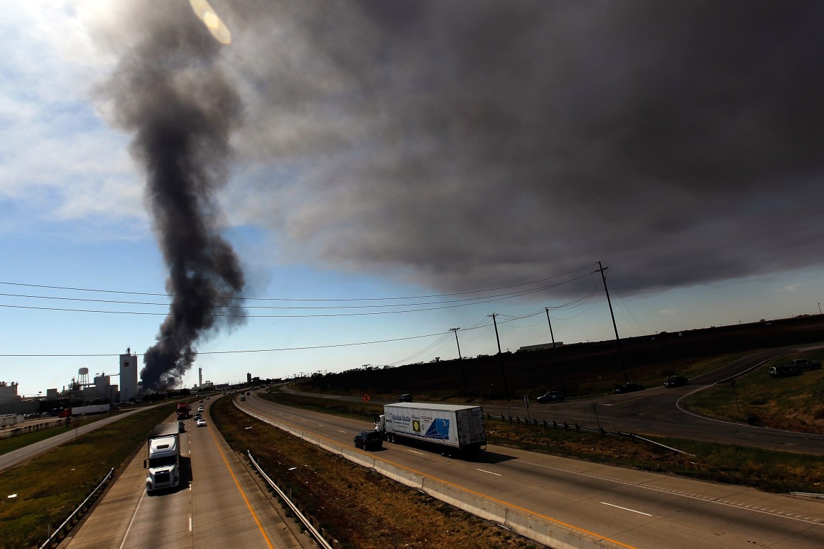 Traffic continues on Interstate 35 as Waxahachie firefighters battle a massive fire at the Magnablend chemical processing plant on October 3rd, 2011, in Waxahachie, Texas.