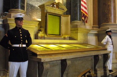 An honor guard stands next to the original copies of the Declaration of Independence, the Constitution, and the Bill of Rights on July 4th, 2001, at the National Archives in Washington, D.C.