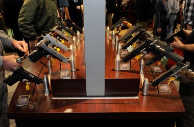 Attendees try out model pistols at a gun show on January 17th, 2012, in Las Vegas, Nevada.